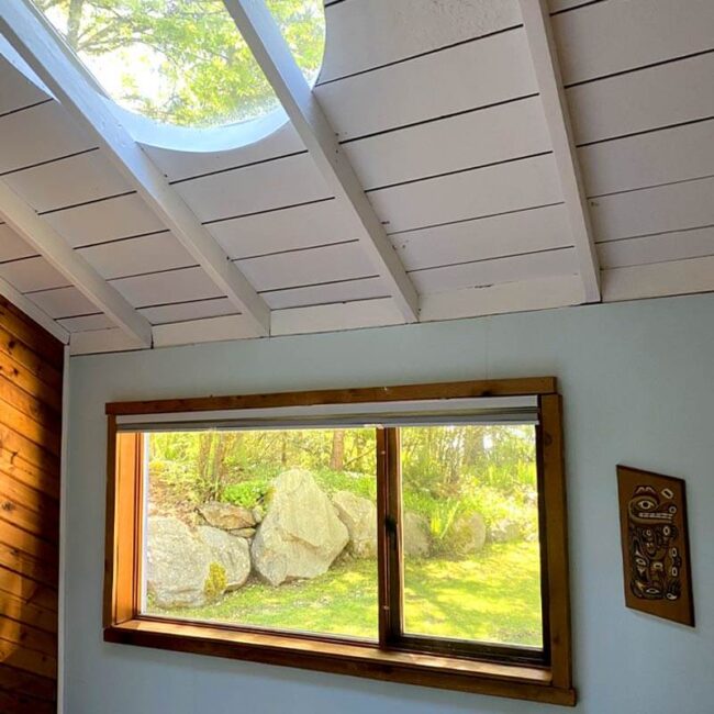 Paul's Cottage by the Lake - skylights from the main bedroom and views of the yard